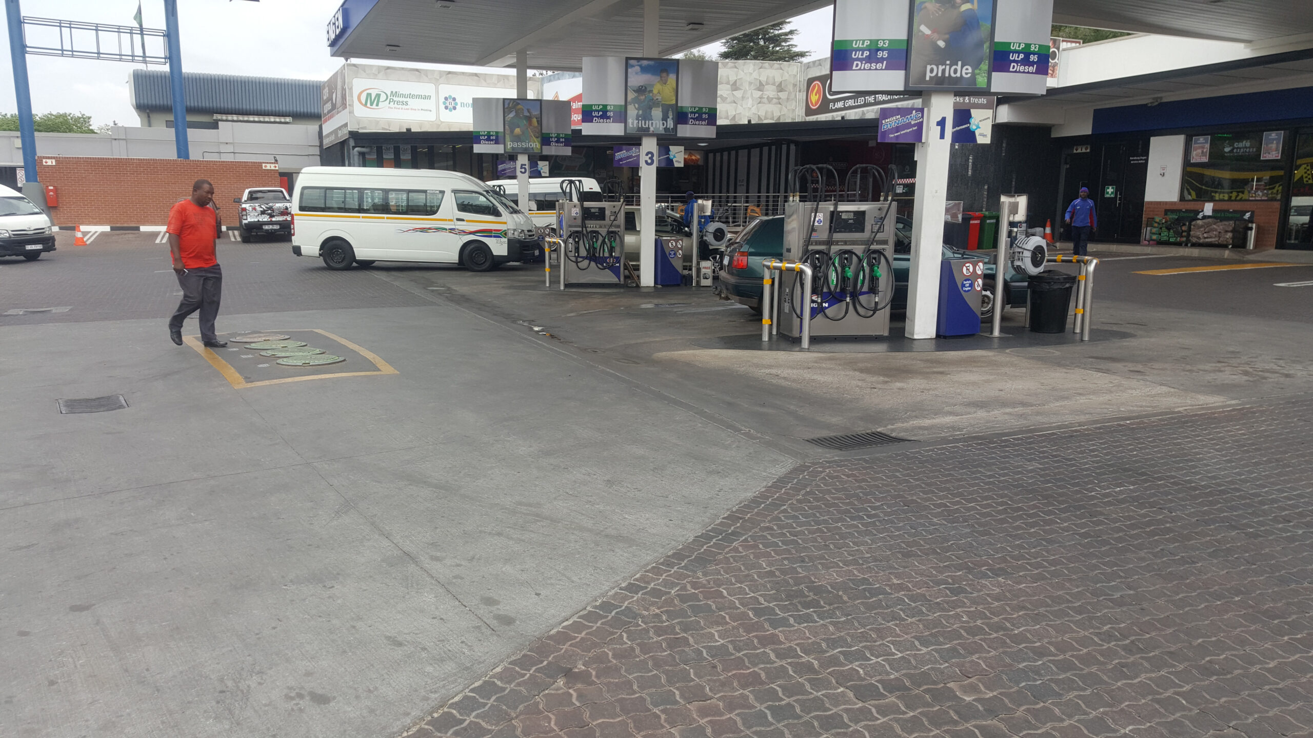 Dirty petrol station forecourt in Johannesburg before cleaning